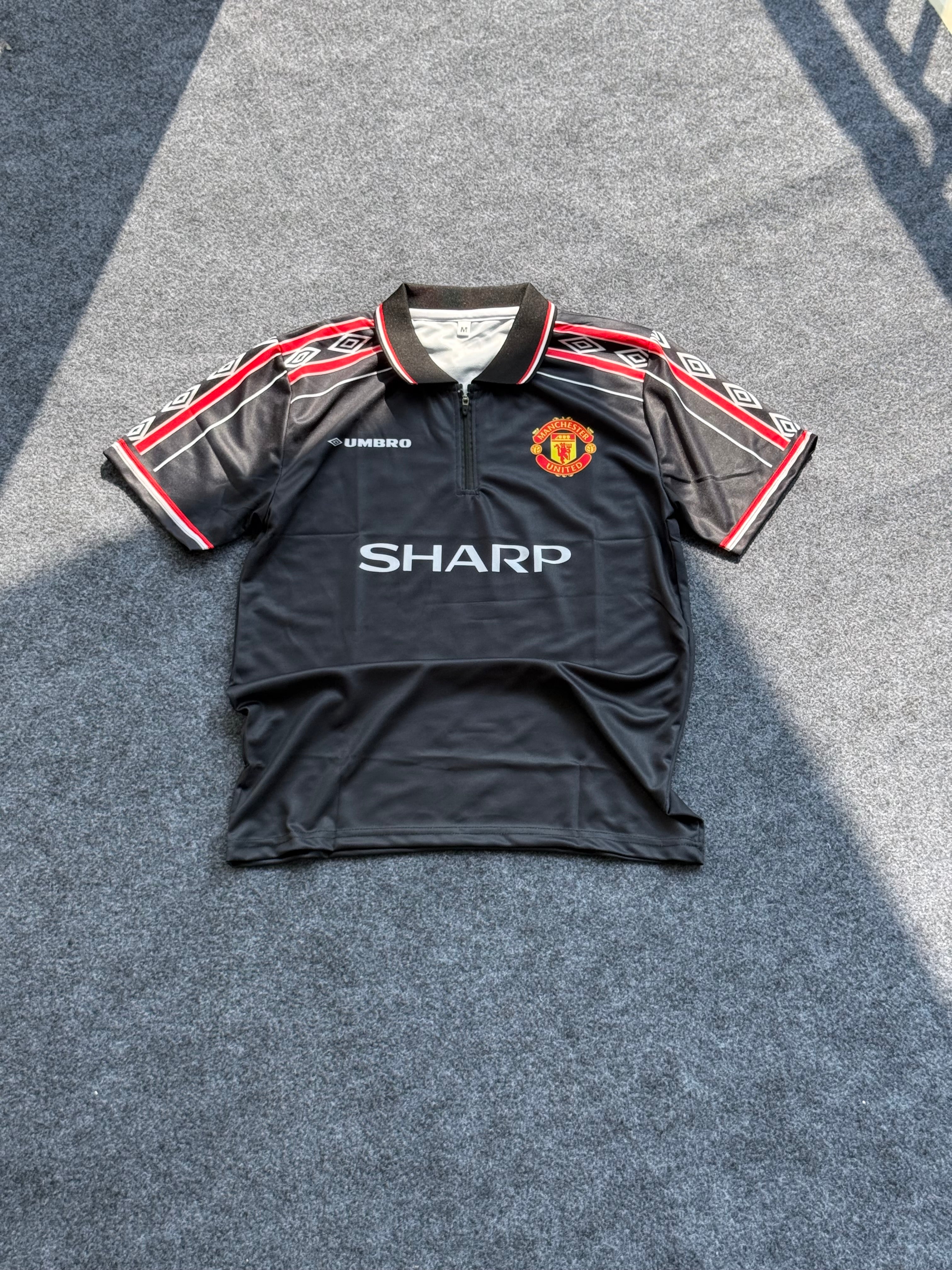 Manchester United 1998-99 season black third football jersey.