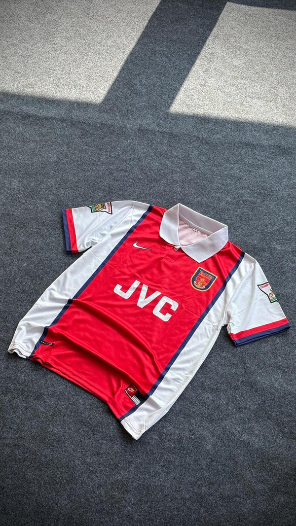 Arsenal 1998-99 home football jersey  with "BERGKAMP 10" on the back.