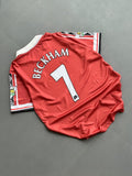 Manchester United 1998-1999 home retro jersey featuring David Beckham's number 7.